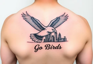 Tattoo On upper bicep 
Philadelphia Eagle classic bird flying over Philadelphia city skyline with the words Go Birds under it tattoo idea