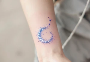 An ethereal Aries tattoo uses dots of light-blue and white to form the constellation in a dreamy galaxy swirl. tattoo idea