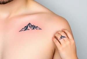 A pair of minimalist black and blue mountain peaks, one tattooed on the father’s forearm and the matching smaller version on the child’s. tattoo idea