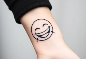 Laughing emoji with stiches tattoo idea