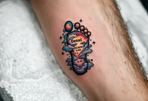 Tiny footprint with the name "Daniel" and 23.1.2019 v 4:45, surrounded by gray and light blue clouds. tattoo idea