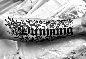 Dunning, left forearm details include angel wing, greek type of font,jungle leaves , tiger claw scratch tattoo idea