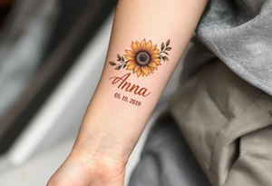 Anna 05. 10. 2019 – A warm orange sunflower design, with Anna's birthdate in bold rust-colored script, complemented by green leafy details. tattoo idea
