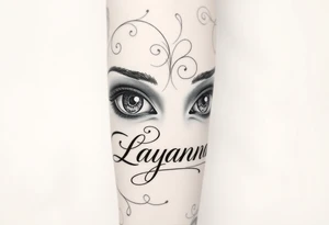 Girl eyes with the name layanna at the bottom of it tattoo idea