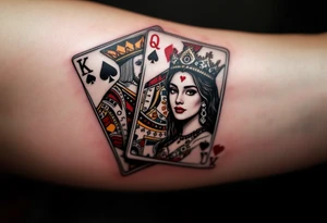 Two playing card symbols—King of Spades and Queen of Hearts—done in black, red, and subtle shading. tattoo idea