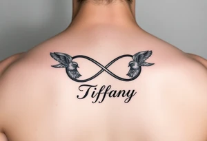 Infinity symbol with birds and the name Tiffany tattoo idea