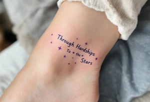 A simple black-ink tattoo wraps “Through Hardships To the Stars” around the ankle, with each word nestled between tiny violet stars. S tattoo idea
