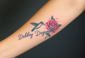 A tattoo on the forearm with the name Debby Deguzman with a humming bird and a rose tattoo idea