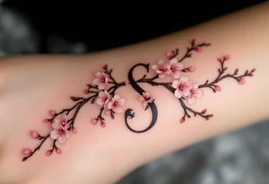 A cherry blossom-covered "S" with pale pink flowers and brown branches. tattoo idea