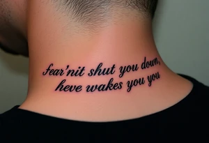 "Fear doesn’t shut you down, it wakes you up" engraved in an elegant script, surrounded by subtle abstract smoke tattoo idea