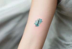 Minimalist thin-line "J" in crisp black, floating above a soft watercolor teal splash. tattoo idea