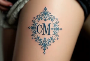Victorian Lace Monogram – Ivory and dusty blue “C / M” styled in ornate vintage typography with lace-like borders. tattoo idea