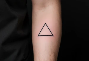 A minimalist black triangle pointing upward, symbolizing stability and strength tattoo idea
