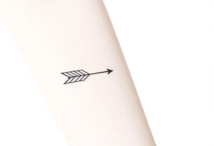 Thin arrow tattoo idea