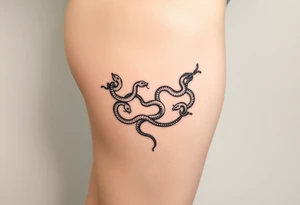 Fine-line thigh tattoo, luxury body chain made of intertwined snakes, Medusa-inspired symbolism, feminine, dainty, blackwork, hip to mid-thigh tattoo idea
