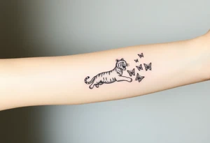 Tiger cub stretching catching 3 butterflies tattoo idea