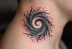 A smoke-gray spiral dissolving into specks of maroon, portraying release and change. tattoo idea