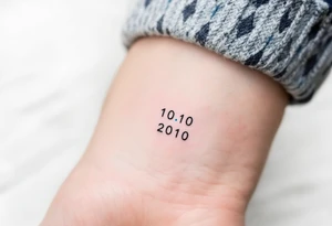 Minimalist 10.10.2010 in thin black sans serif with a small sky-blue dot between each number. tattoo idea