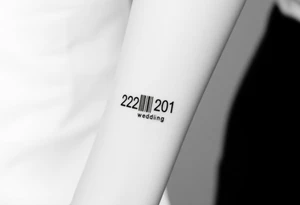 A sleek, minimalist barcode with the couple’s wedding date (22 - 12 - 2012) hidden in the numbers, symbolizing a love marked in time tattoo idea