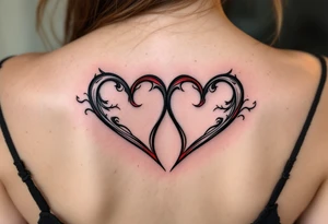 Two half-heart tattoos in black with red tips that form a full heart when side by side. tattoo idea