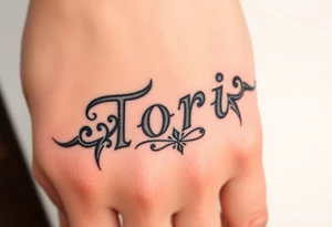 Name Tori with a lot tribal tattoo idea