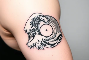 waves crashing into a vinyl record tattoo idea