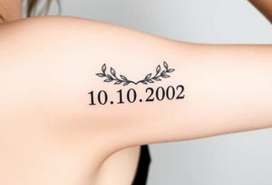roman numerals of 10.10.2002 in laurel crown in an ancient roman styles tattoo idea