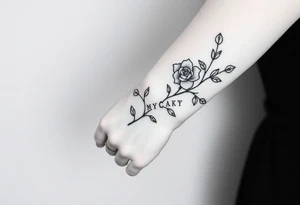 Rose on hand with vine wrapping around arm coming across to peck with family’s name on my peck in crossword tattoo idea