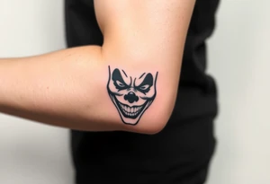poker joker face in bad clown mask tattoo idea