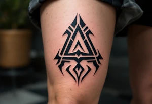 A tribal-style "A" in solid black with bold, sharp-edged lines. tattoo idea