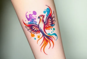 Phoenix in fire with purple, blue, orange, teal and green splashes, looking up tattoo idea