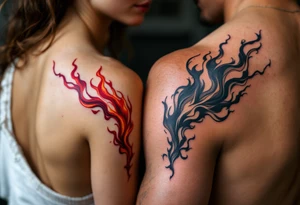 Matching red and orange flame tattoos on one partners shoulder and on second partner shoulder tattoo idea