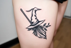 Which is broom with handle
 a witches hat with leaves tattoo idea