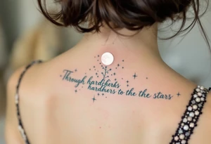 Flowing in teal ink across the spine, “Through hardships to the stars” is crowned with a glowing white moon. tattoo idea