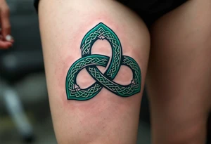 A bold Celtic triskeles  in deep emerald green, with intricate knotwork woven into each spiral, symbolizing eternal growth and balance. tattoo idea