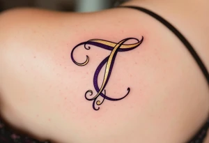 A bold calligraphy "T" in deep plum ink with gold accents curling around its edges. tattoo idea