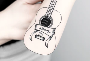 Accustic Guitar with ribbon wrapped around with In Loving Memory inside ribbon tattoo idea