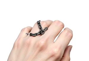 gothic chains intertwined on index finger and thumb connecting together from fingers tattoo idea