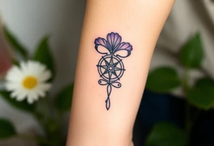 A single Violet with detailed compass at its center representing feminine power and an ankh or Celtic knot tattoo idea