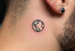 A small, minimalist Earth outlined in black with a hint of aqua and lime shading sits behind the ear. tattoo idea