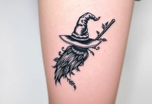 Which is broom with handle
 a witches hat with vines and feathers 
Smaller broom with hat placed on top or in the middle
Feminine and on a leg tattoo idea
