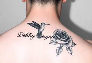 A tattoo on the forearm with the name Debby Deguzman with a humming bird and a rose tattoo idea
