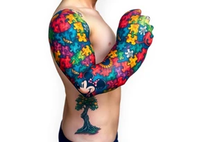 autism puzzle full color left arm sleeve completely covering full arm including Mickey Mouse and tree to start the bottom of the sleeve tattoo idea