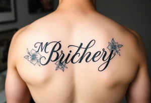 My brothers name packey in pretty cursive with floral tattoo idea