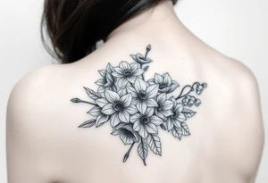 realistic bouquet of daffodils, daisies, lily of the valley on woman upper arm tattoo idea