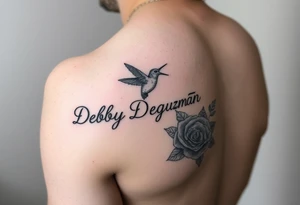 A tattoo on the forearm with the name Debby Deguzman with a humming bird and a rose tattoo idea