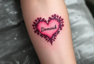 A solid pink heart with lace-like details and the name Dominik in script. tattoo idea