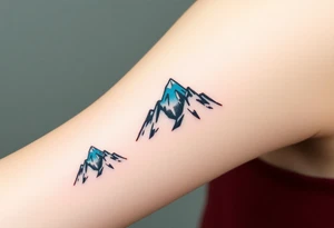 A pair of minimalist black and blue mountain peaks, one tattooed on the one´s forearm and the matching smaller version on the cother tattoo idea