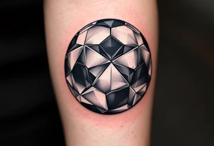 A geometric-style soccer ball made of interlocking black, gray, and metallic silver triangles. tattoo idea