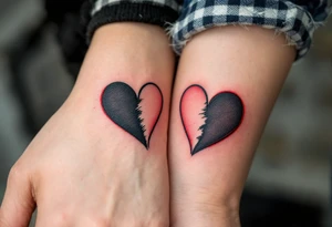 Two half-heart tattoos in black with red tips that form a full heart when partners wrists are side by side tattoo idea